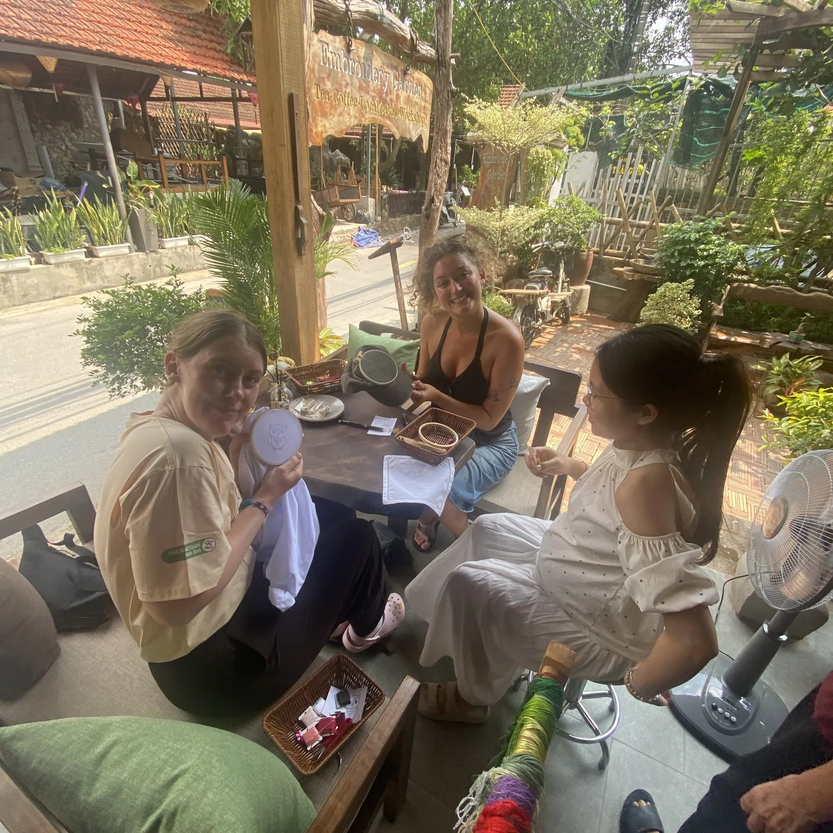 Travelers sharing a hand-embroidery experience at our Tam Coc workshop